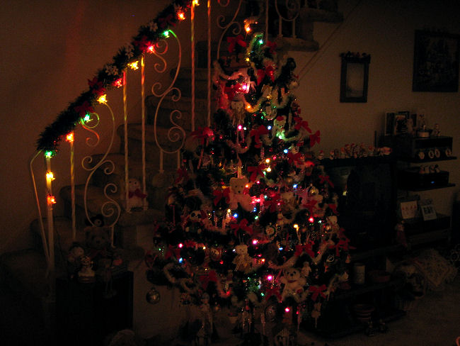 Christmas tree decorated with bears all lit up